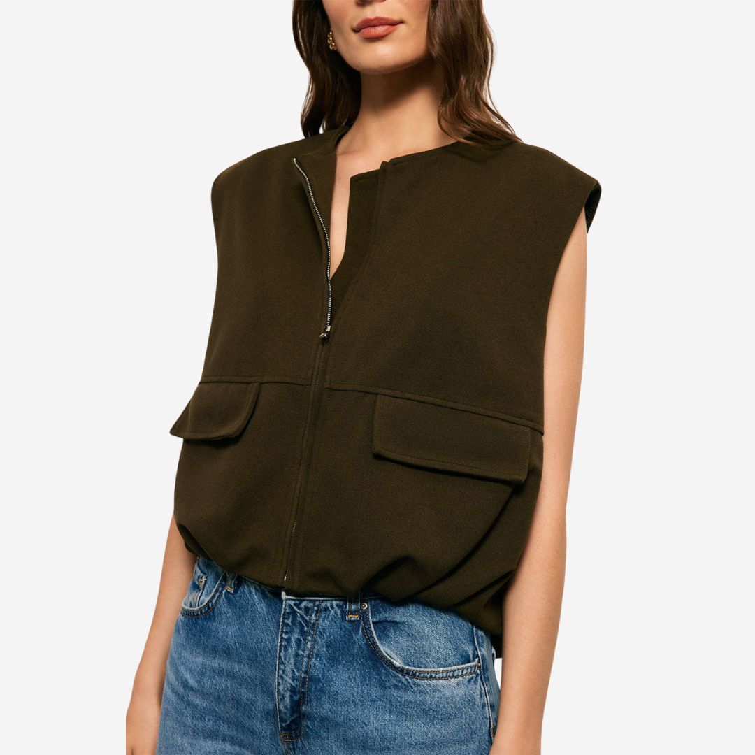 Mörkgrön ärmlös jackväst i strukturerat tyg med dragkedja och ficklock för dam
