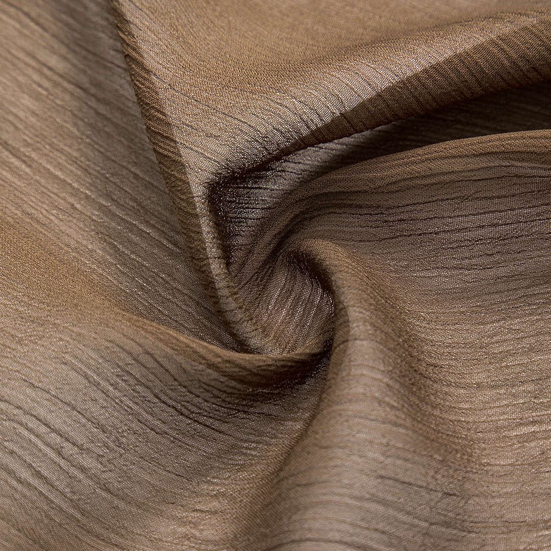 Brun transparant volangblus i lätt strukturerat tyg med markerad midja och knytband