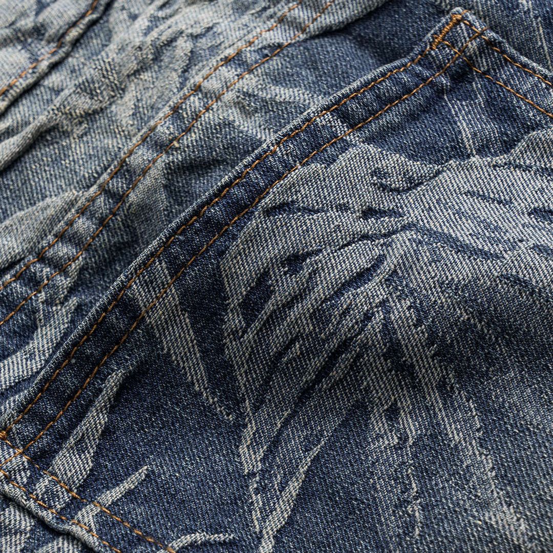 Tonade blå denimjeans med vävt bladmönster, hög midja och rak vida passform i bomullsblandning