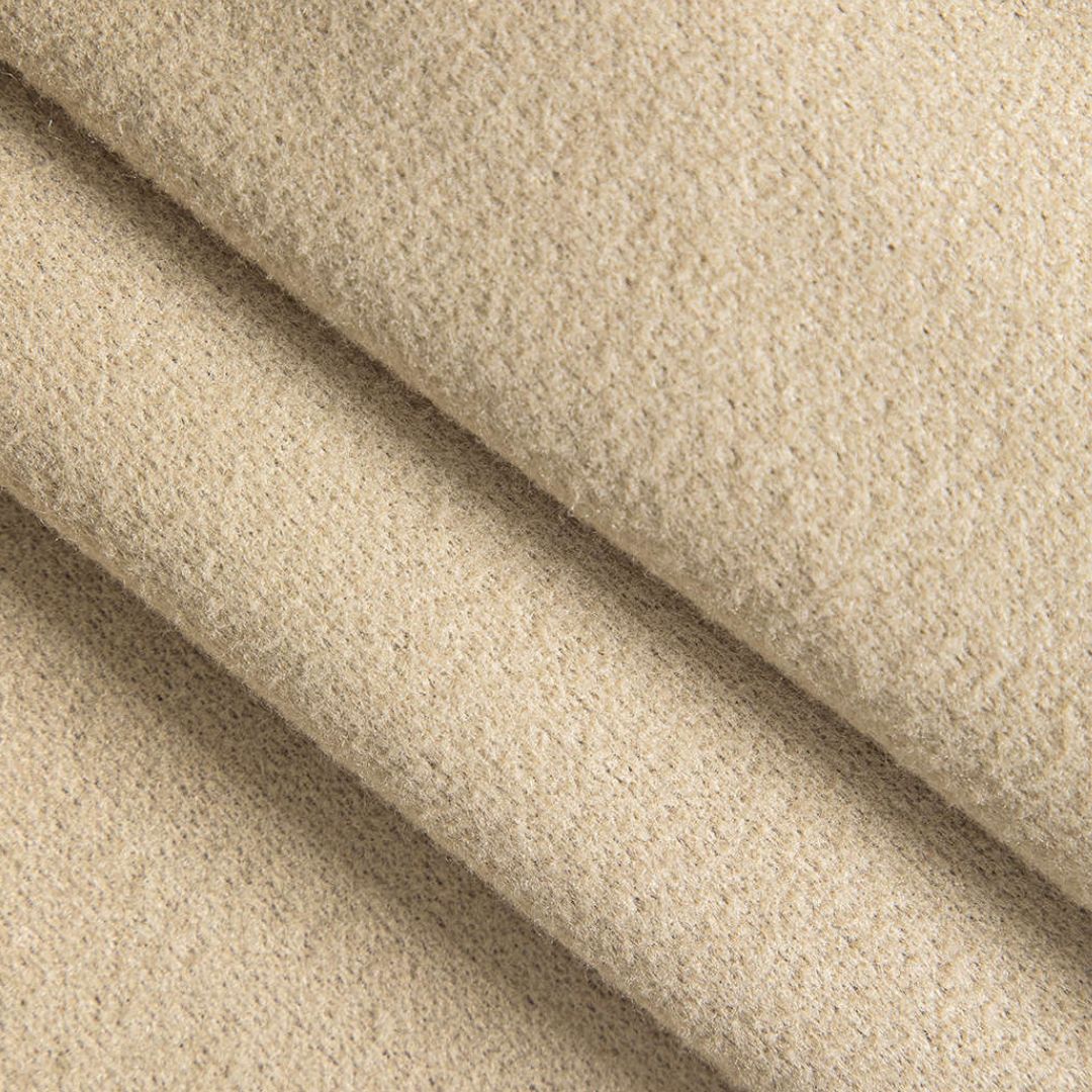 Beige kort jacka i strukturerad tygblandning med v-ringning och knappar framtill