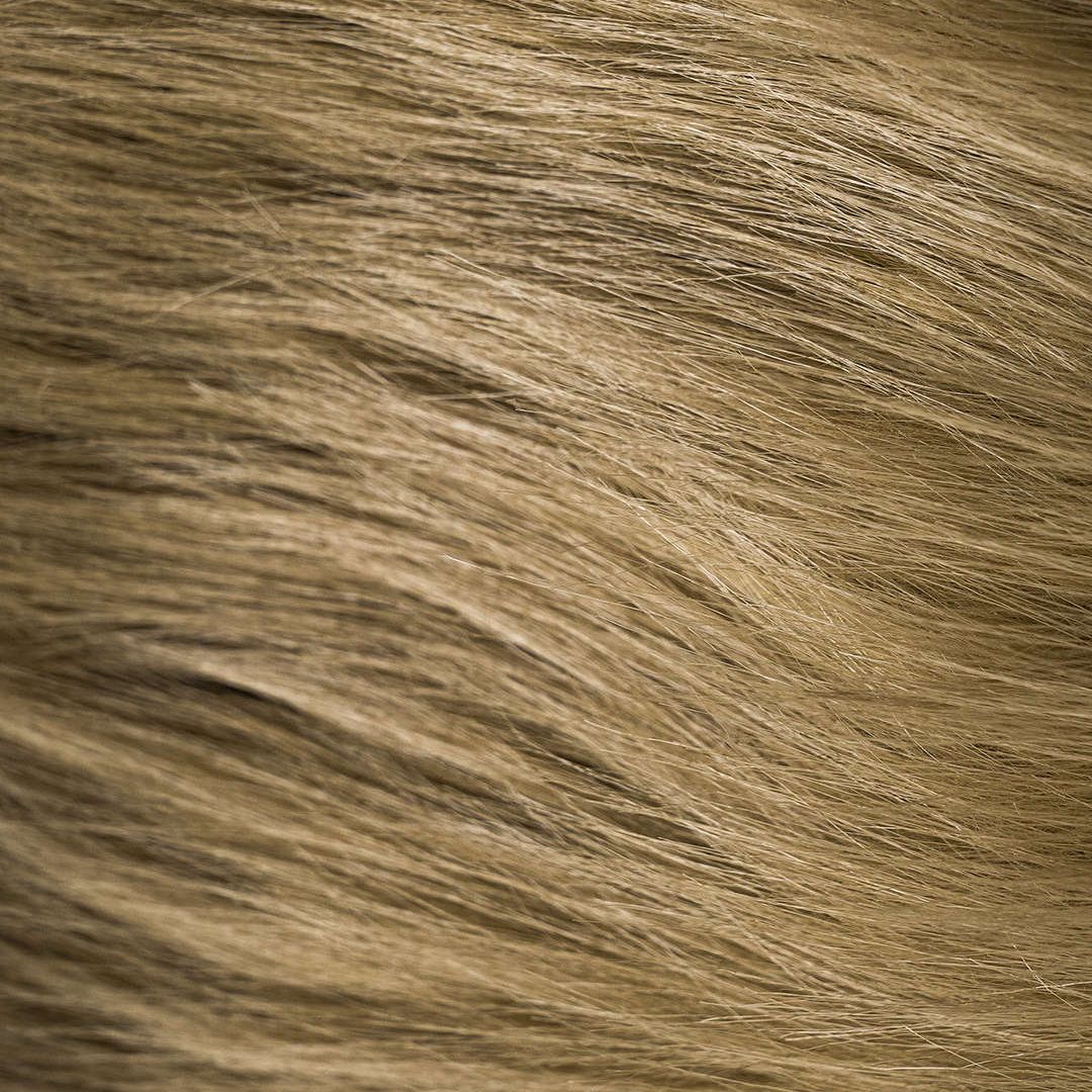 Brun jacka i fusk­läder med fuskpäls och dekorativa fickor för dam