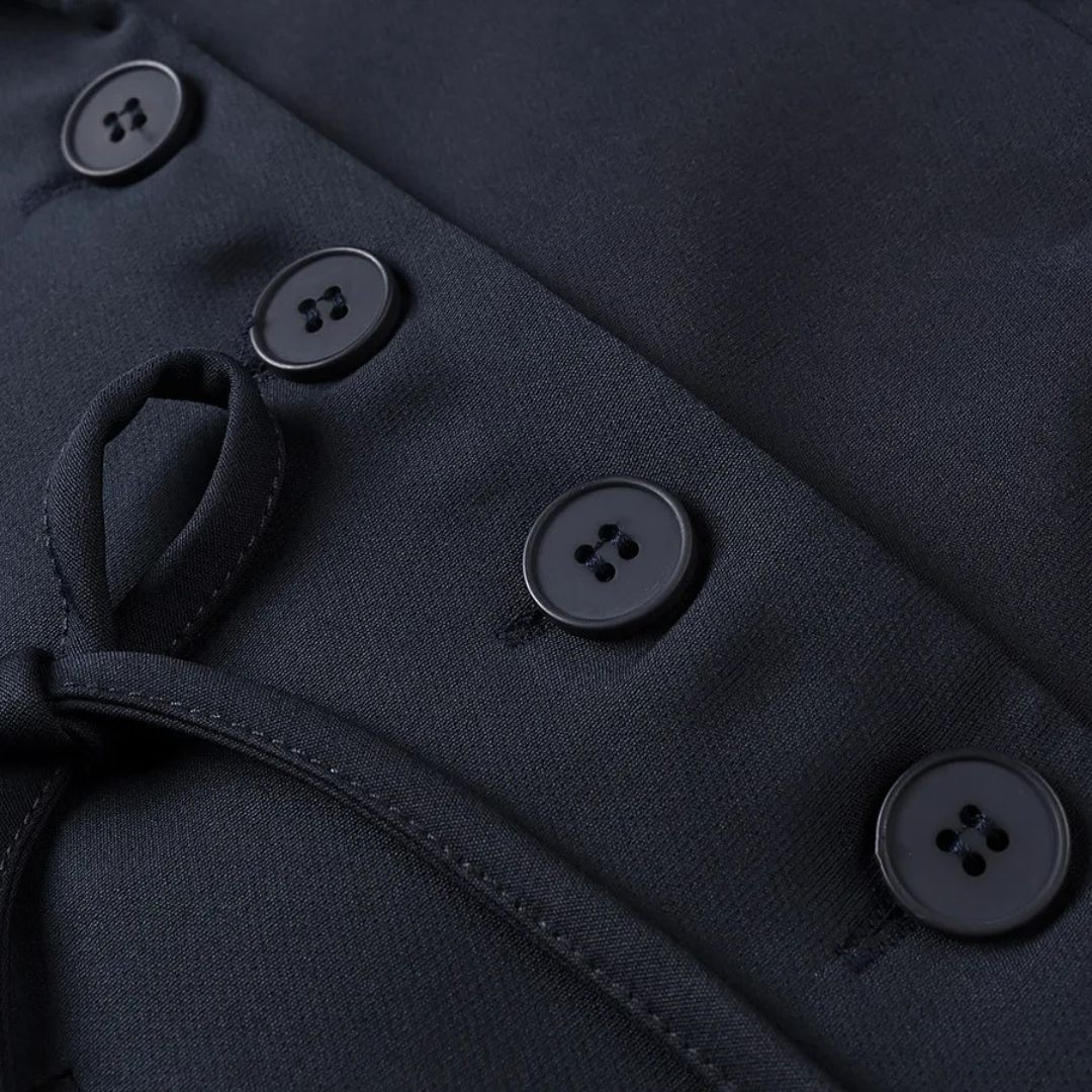 Enkelknäppt kavaj med slagkrage och dekorativa rosetter