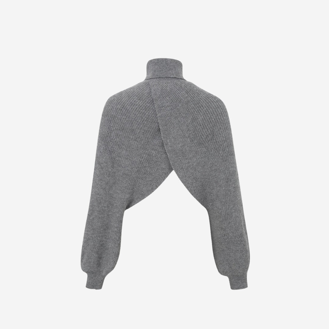 Stickad bolero med omlottdesign, polokrage och lös passform