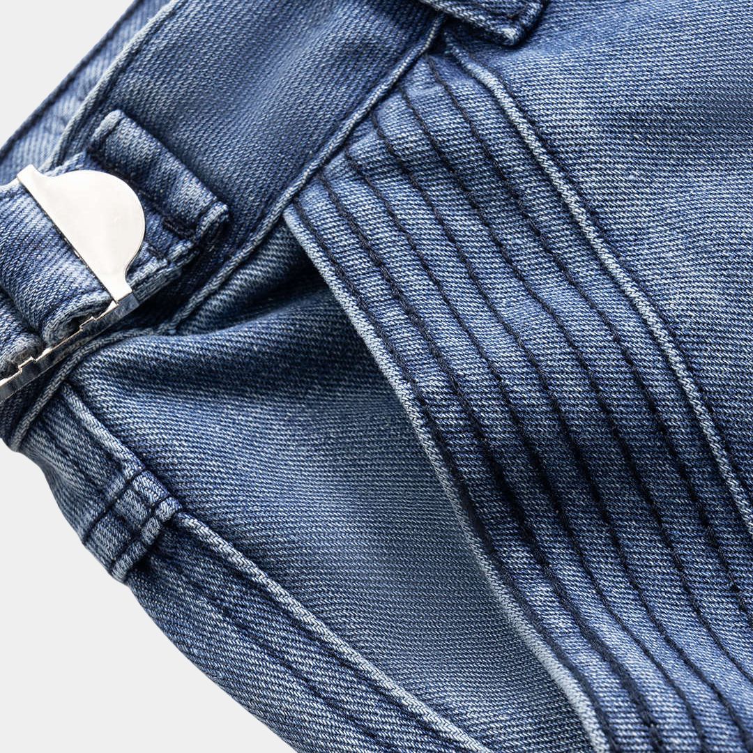 Mörkblå denimbyxor med veckade sidsömmar, panelkonstruktion och bred silhuett i kraftig tvättad bomullsblandning