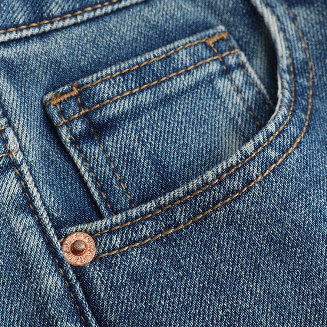 Mörkblå utsvängda jeans med vintage tvätteffekt, låg stretch och figurnära passform i mjuk bomullsdenim