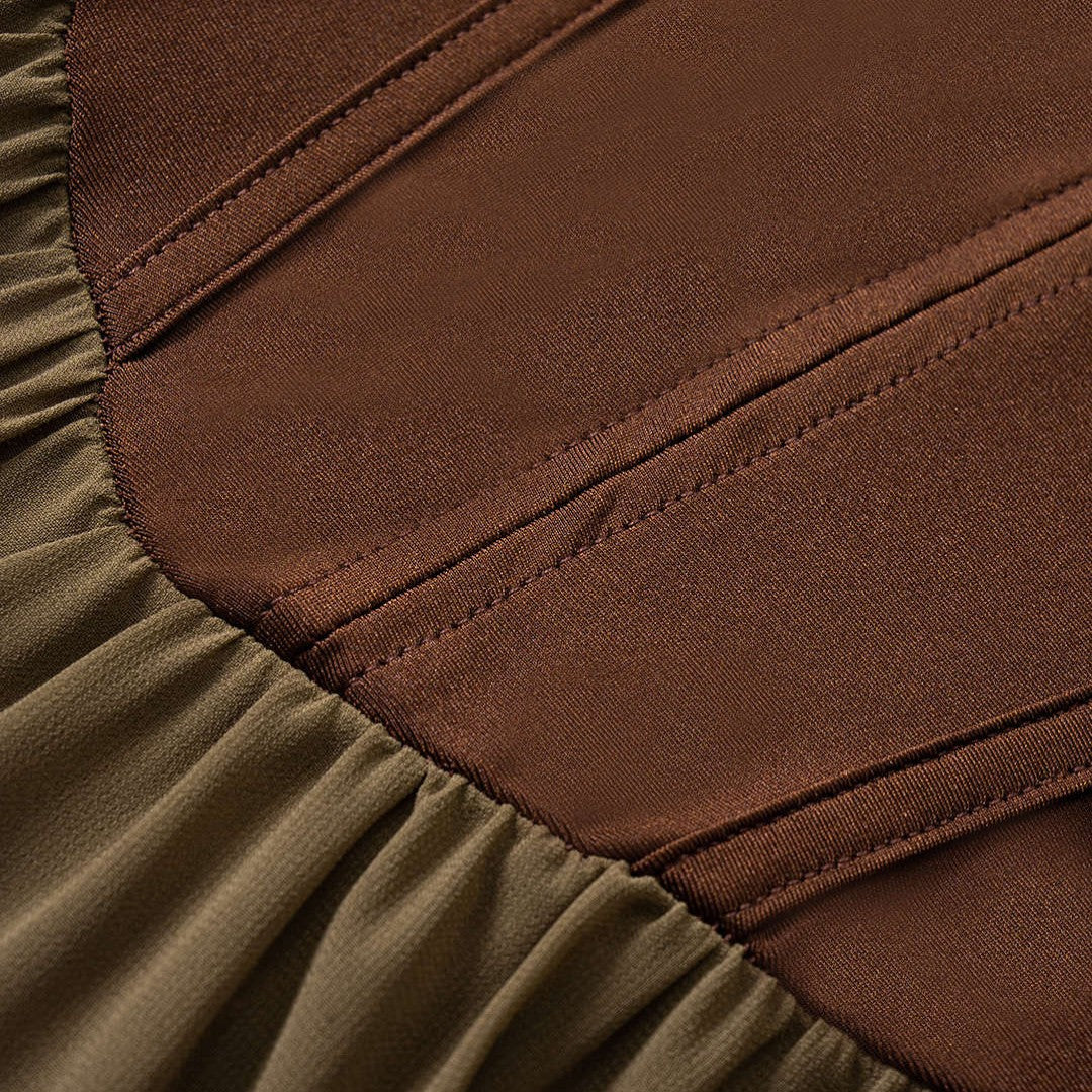 Tvåfärgad midiklänning med korsettliv, snörning och transparent kjol i ljusbrun mesh