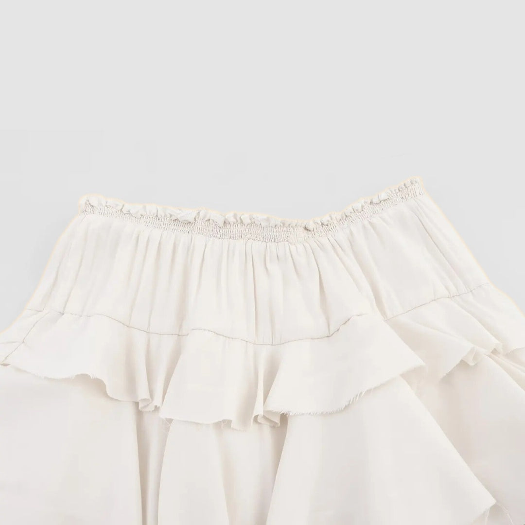 Vit Kjol i midilängd med naturlig midja lager på lager volanger och A-linje silhuett