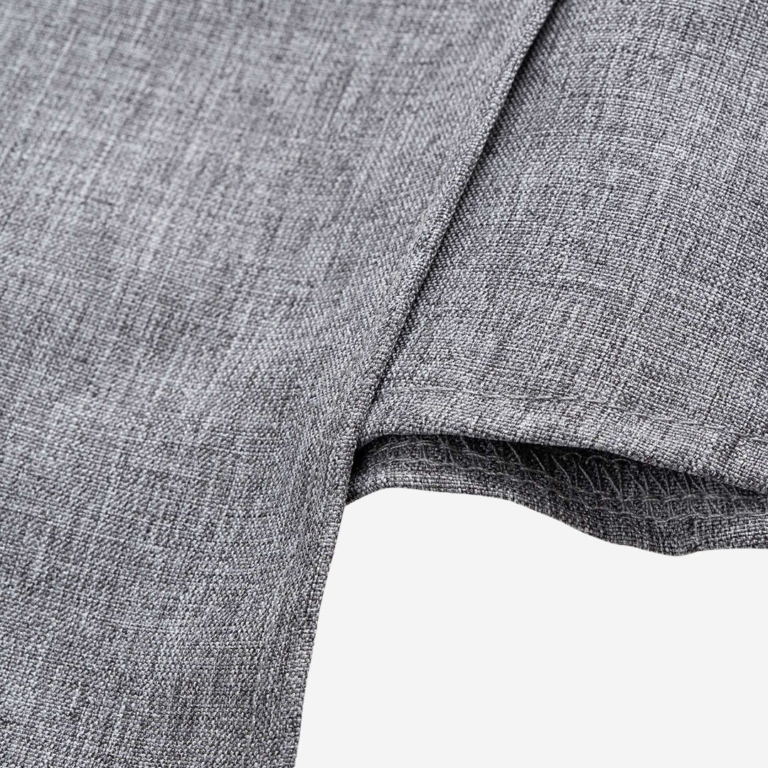 Ljusgrå ärmlös omlottopp i vävt tyg med draperad midja och asymmetrisk fåll