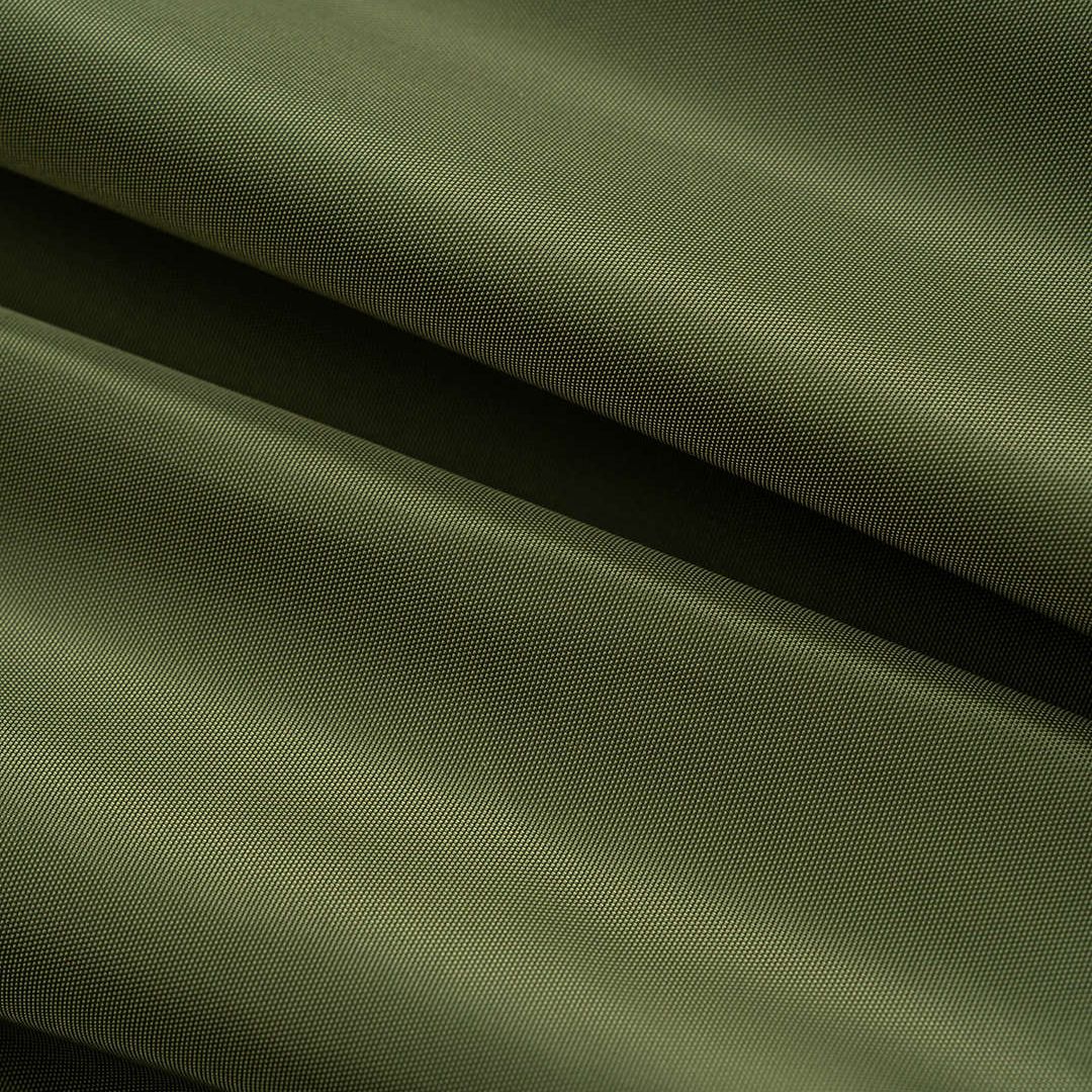 Grön bomberjacka med denimdetaljer i patchwork