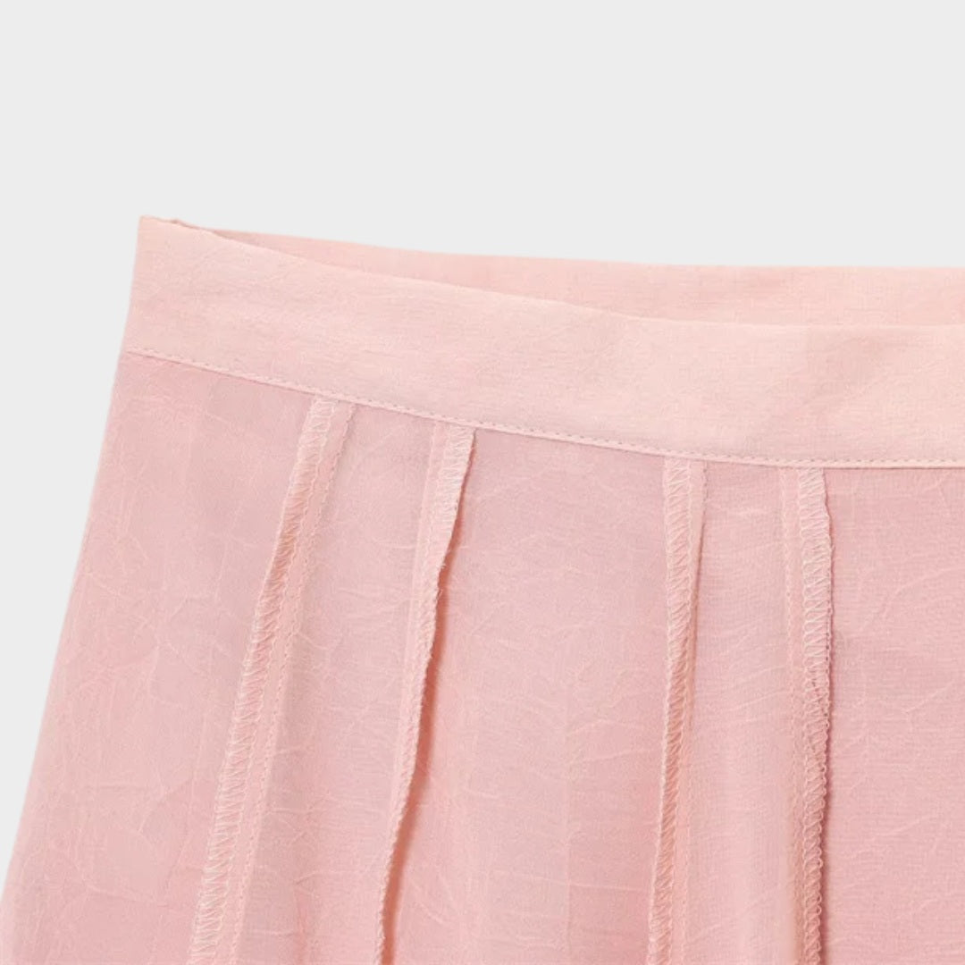 Ljusrosa Långkjol i ljusrosa med A-linjeform och svepande silhuett