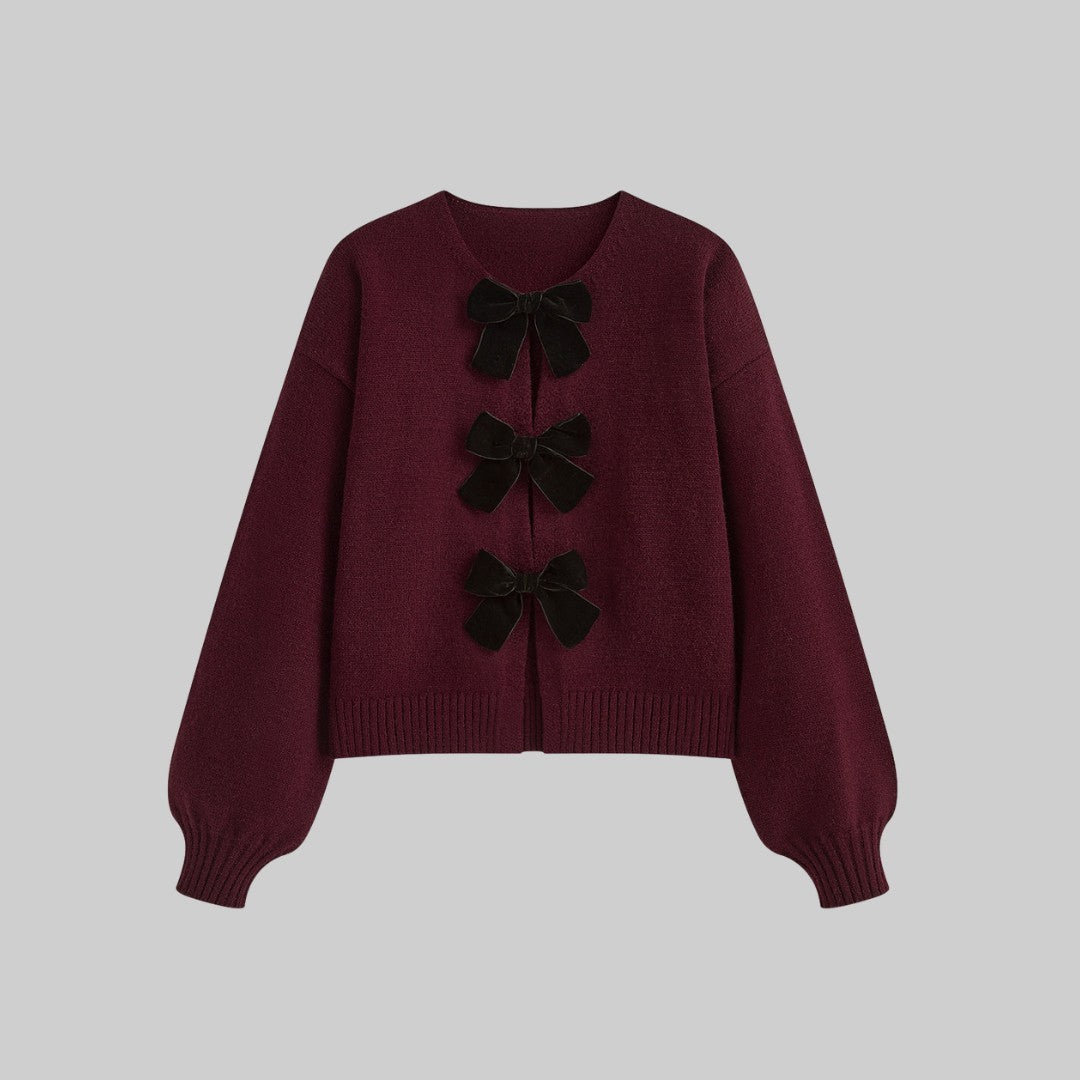 Stickad cardigan med sammetsrosetter och ballongärmar i mjuk stretchkvalitet