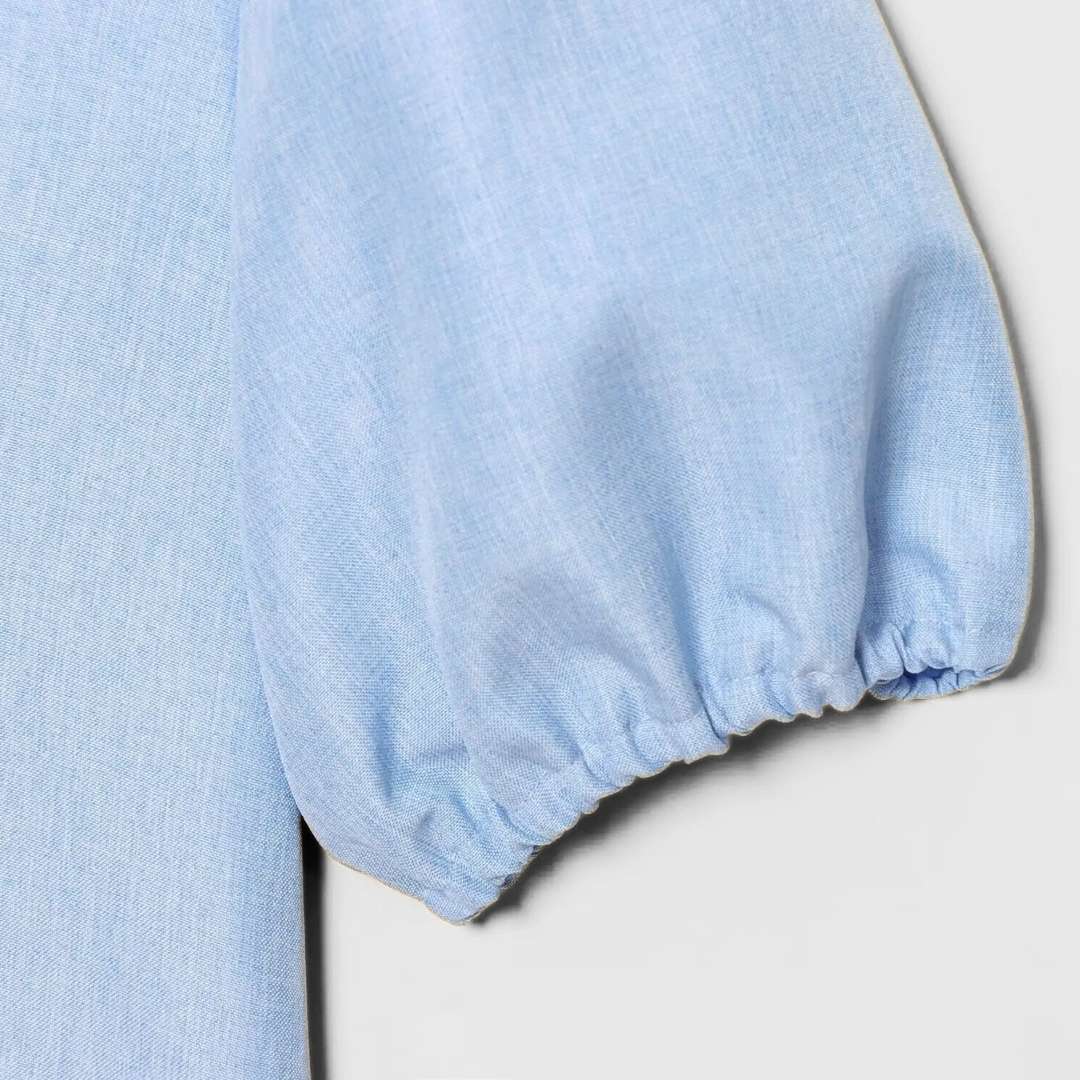 Blus med puffärm och knytband framtill i vävt tyg