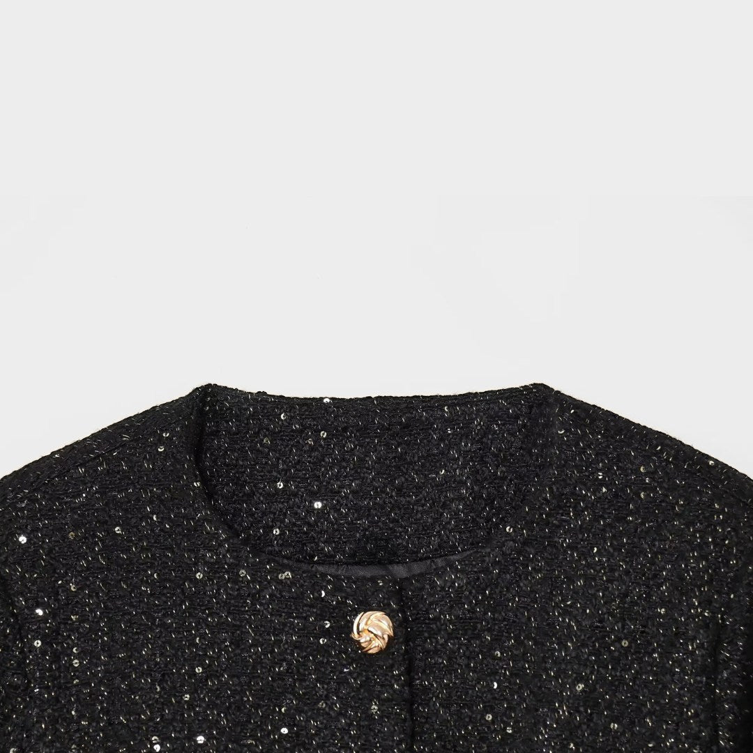 Jacka i tweedstil med rund hals paljettdetaljer och knäppning