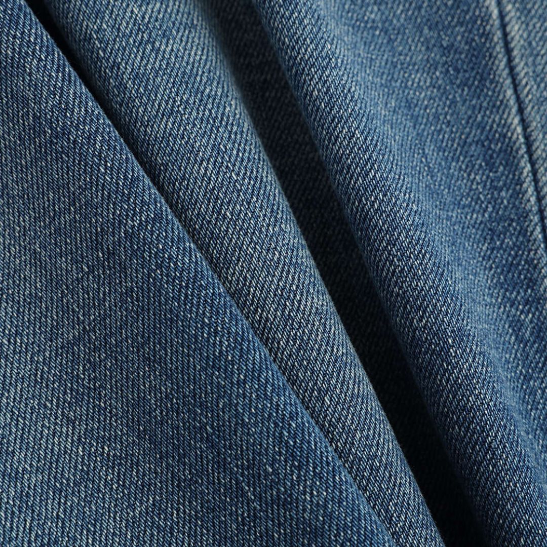 Mörkblå utsvängda jeans med vintage tvätteffekt, låg stretch och figurnära passform i mjuk bomullsdenim