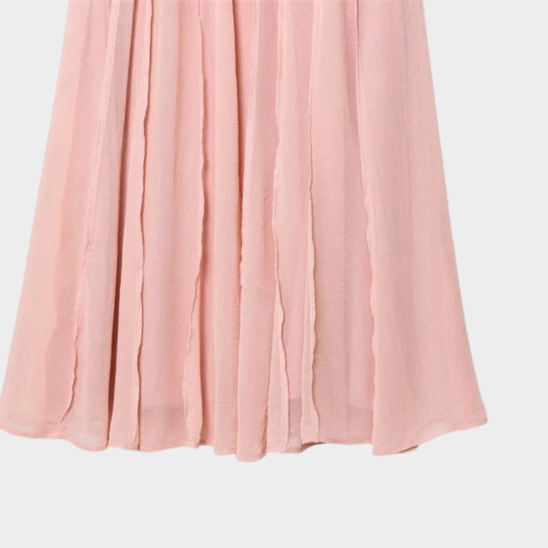 Ljusrosa Långkjol i ljusrosa med A-linjeform och svepande silhuett