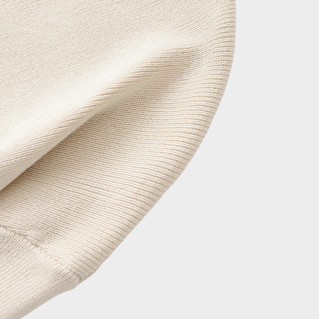 Beige ribbstickad damkofta med knappar