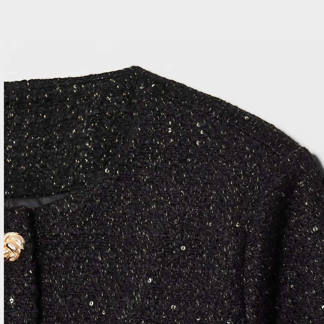 Jacka i tweedstil med rund hals paljettdetaljer och knäppning