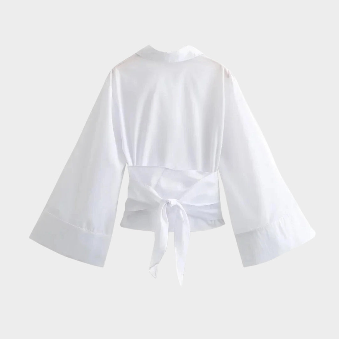 Omslagsblus med V-ringning och vida ärmar