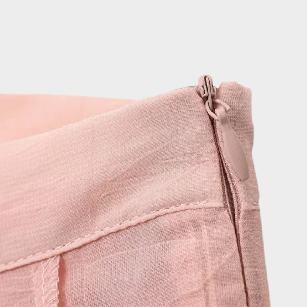 Ljusrosa Långkjol i ljusrosa med A-linjeform och svepande silhuett